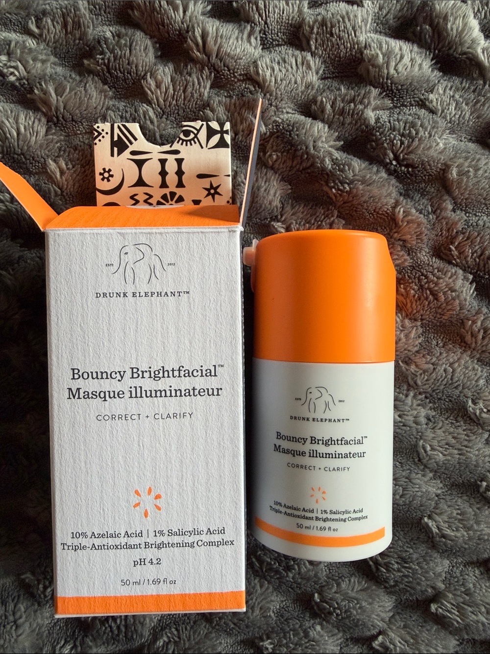 Drunk Elephant Bouncy Brightfacial™ Mask in Bright Orange & White Packaging